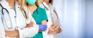 healthcare people group professional doctor standing in hospita - Медицински център "Орто Пункт"